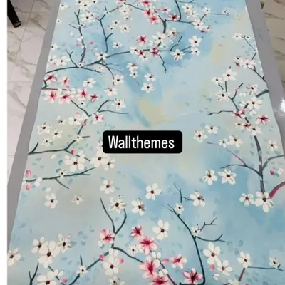 A beautiful cherry blossom wallpaper design with white and pink flowers on a sky-blue background, shown laid out flat.