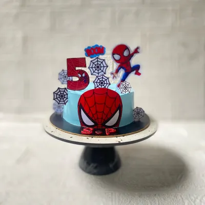 Your friendly neighbourhood Spiderman, ready for a 5th birthday party. This chocolate cake features a sky-blue frosting, spider webs, and our hero in action.