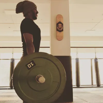 Completing a heavy deadlift. This exercise is the king of lifts for a reason, building strength from your legs to your back. We use progressive overload to ensure you get stronger safely and consistently.