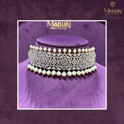 Turn heads with this exquisite diamond and pearl choker. The intricate floral filigree work is designed to make a statement, perfect for a modern bride or a grand gala.