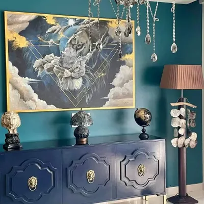 "The Stare." This commissioned acrylic on canvas painting was designed to be a powerful and dramatic centerpiece for a client's home. The surreal composition blends the face of a lion with clouds and geometric lines, creating a sense of strength and mystery.