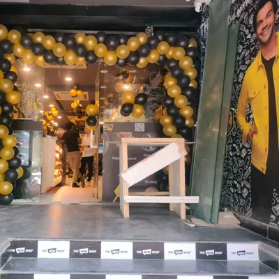 A full view of the entrance decor we did for The New Shop's opening. The black and gold balloon arch is a classic and effective way to create a festive and inviting atmosphere for a new store launch.