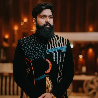This client chose our abstract art bandhgala for his special event. The unique design and perfect fit highlight his personal style and commanding presence.