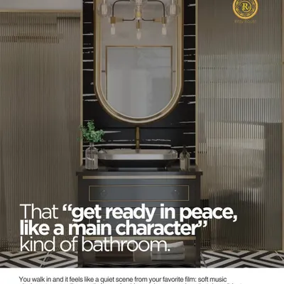 That "get ready in peace, like a main character" kind of bathroom. This space features a statement vanity with a black marble countertop, a large arched mirror, and dramatic lighting to create a feeling of quiet confidence and luxury.