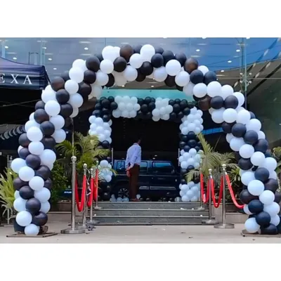 This grand balloon arch in black and white created an impressive entrance for the Nexa showroom during the Invicto car launch event. It sets a premium tone right from the start.
