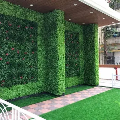 This is how you make a grand entrance. I covered the entire front facade of this building with a vertical garden, including inset panel designs. It completely transforms the property's curb appeal.