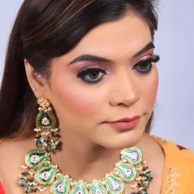 A close-up of a colorful party look. I used a blend of pink and blue eyeshadows to create a vibrant eye, balanced with a neutral lip color and defined brows.