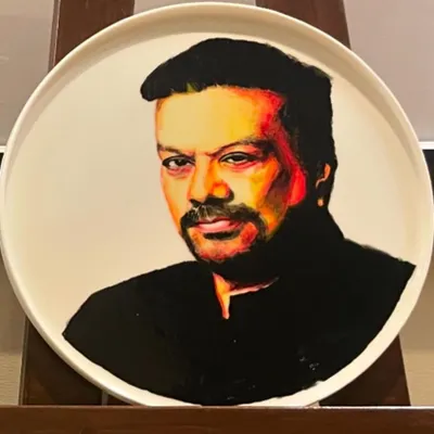 A portrait of celebrity journalist Vir Sanghvi, painted with ceramic paints on a bone china porcelain plate. This was a unique commission for ITC Gardenia that required a completely different technique from painting on canvas.