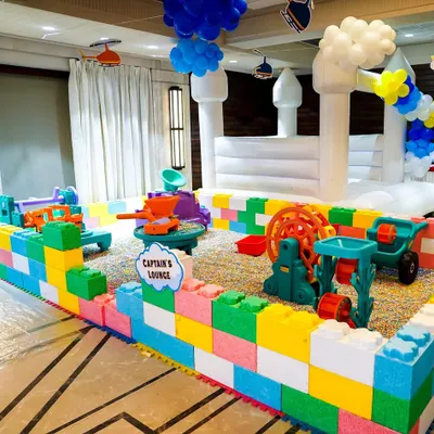 We design unique play areas like this Sensory Sand Pit, enclosed by colorful Lego-style blocks. It provides a safe and engaging tactile experience for younger children at indoor or outdoor parties.