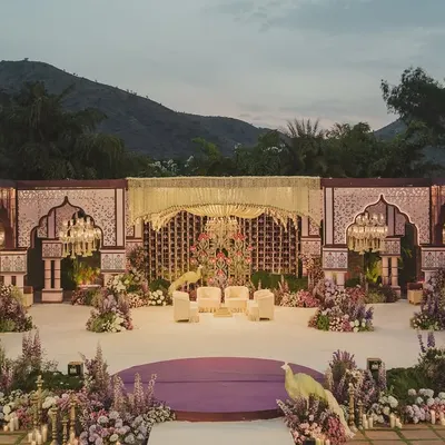 The brief was to bring Vrindavan to Udaipur. We created this breathtaking mandap against the Aravalli hills, using intricate architecture and lush florals to craft a sacred space that felt both grand and spiritual.