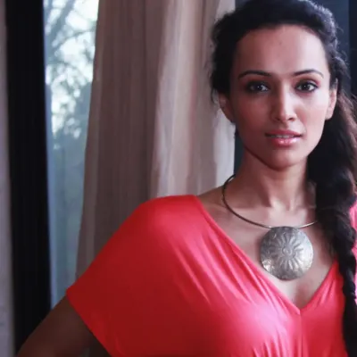 A throwback to a quick, natural light photoshoot with the supermodel and actress Dipannita Sharma. This close-up portrait captures her direct and confident gaze, showcasing her natural beauty in the comfort of her own home.