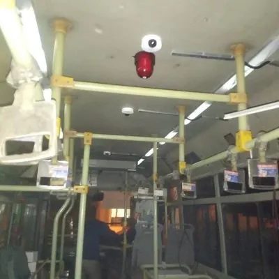 Here you can see a dome camera and panic button I installed on the ceiling of a bus. I am experienced in vehicle surveillance setups for transport companies that need to ensure passenger safety and monitor their fleet.