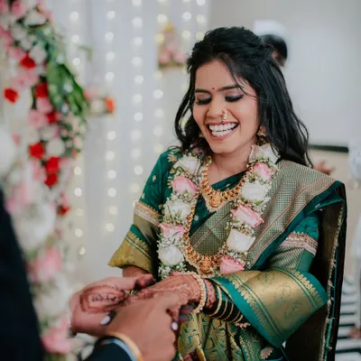 A moment of pure, unscripted laughter from the bride-to-be during her engagement ceremony. These are the genuine emotions I strive to capture.