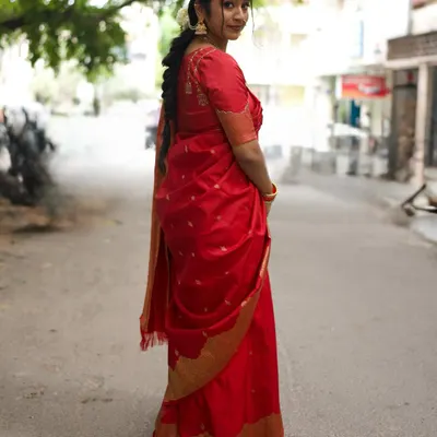 Wishing everyone a happy Ganesha Chaturthi with this traditional look. This is a full view of my vibrant red saree, perfect for the festive season. The rich color and gold border make it a classic choice.