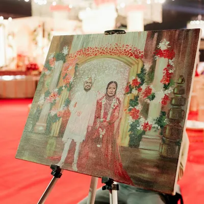Bringing the varmala to life with live painting. I arranged for an artist to capture the ceremony on canvas, creating a timeless masterpiece and a unique entertainment experience for guests.