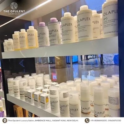 A shelf stocked with Olaplex products. I use these to repair, protect, and strengthen your hair during and after chemical services.