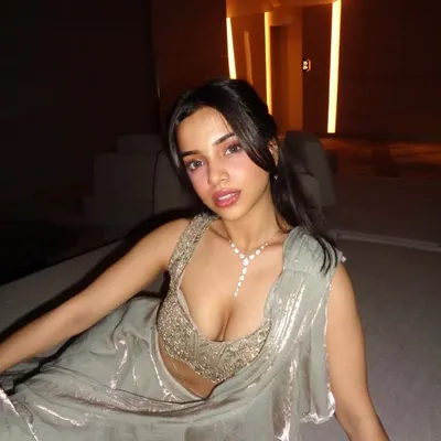 This is how you do modern desi glam. A stunning diamond and sequin studded drape saree in a muted sage green. The heavily embellished blouse and shimmering fabric are perfect for a cocktail party or reception.