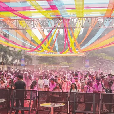 The setup for a massive Holi 2025 party. The colorful streamers and huge crowd show the scale of the event, and I was ready to bring the energy.