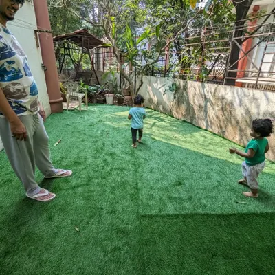 The final result of a backyard makeover. What was once a bare patch of soil is now a safe and beautiful Paspalum grass lawn, perfect for the client's children to play on.