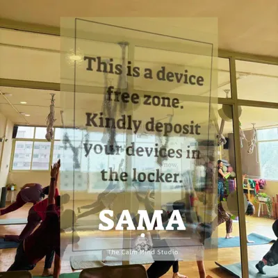 This is our gentle reminder at the studio entrance. By depositing your devices, you give yourself the gift of a true digital detox, allowing for deeper mindfulness and a more restorative practice.