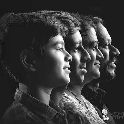 A beautiful and timeless family portrait. This side-profile shot in black and white shows the connection across generations, creating a powerful and artistic family heirloom.