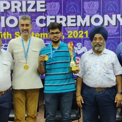 One of our academy's shooting stars with his gold medal and champion's trophy in the 10m Air Pistol event. It's a pleasure to see our shooters reach the top of the podium.