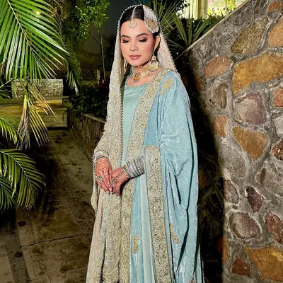 A full-length shot of my stunning Nikah bride. Her pastel blue and silver outfit is paired with soft, ethereal makeup, making her look like a true Shehzaadi.