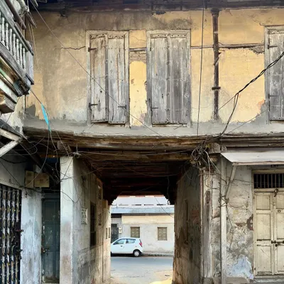 An old building in the Majumdar Wada of Vadodara. Structures like these are repositories of memory and vernacular building traditions, offering crucial lessons in climate response and the graceful aging of materials.