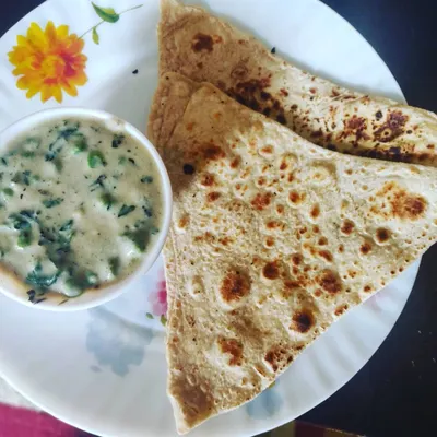 Creamy Methi Mutter Malai served with hot parathas. This rich and flavorful dish is a highlight of my North Indian menu.