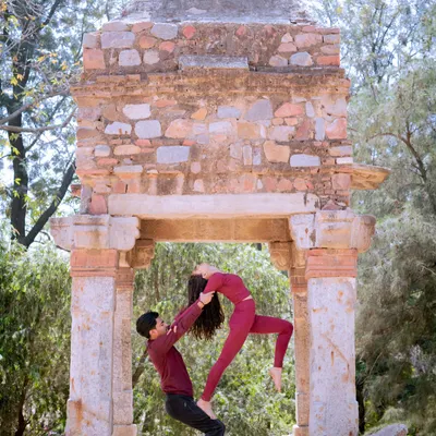Creating beautiful shapes together. This standing acro yoga pose, framed by a historic arch at Lodhi Garden, shows the blend of balance, trust, and artistry we cultivate in our practice.