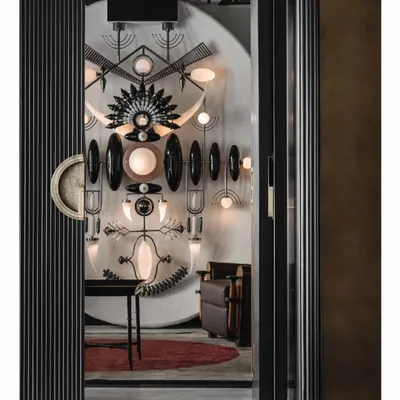 This is the pièce de résistance of the Aria project. We designed the space around this majestic Totem light installation, creating a focal point that is both a source of light and a piece of sculptural art. The fluted sliding doors open to reveal this dramatic centerpiece.