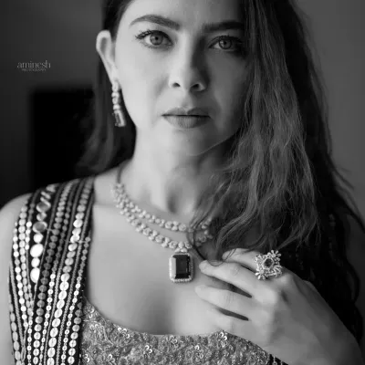 A striking black and white portrait of an actress. The focused lighting and direct gaze create a powerful and memorable headshot, perfect for a professional portfolio.
