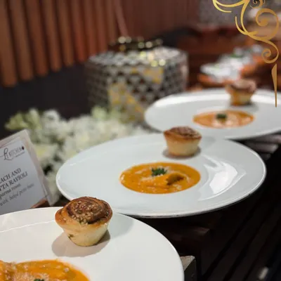 Handcrafted spinach and ricotta ravioli served in a rich tomato crema, garnished with fresh parsley and served with a savory muffin. A taste of Italy, made with love.