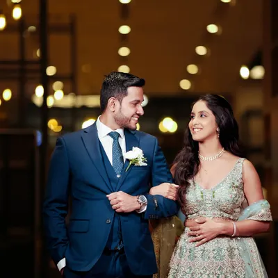 A beautiful moment between the couple. Her soft pink shimmer eye look and radiant base create a look of pure magic, perfect for their special day.