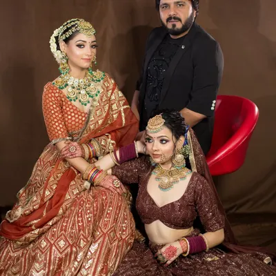 A proud moment with two of my beautiful brides in the studio. It's always a joy to see my vision come to life and to be a part of their special day.