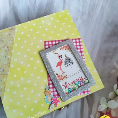 The lid of a bright yellow birthday hamper, decorated with a personalized shaker frame for Shravani. I love making the box as special as the gifts inside.