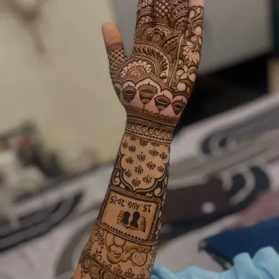 This design was personalized for an engagement. I included the couple's silhouette and their special date, "15.AUG.2025", right on the forearm.