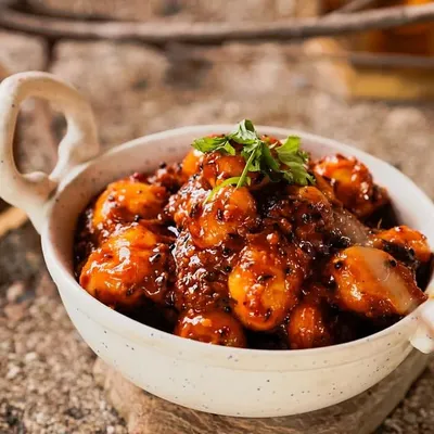 My Tamarind Potatoes are a perfect balance of sweet and tangy. Baby potatoes are cooked in a thick, flavorful tamarind sauce and garnished with fresh cilantro.