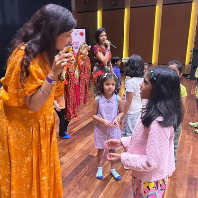 Our co-founder Kamakshi interacts with young participants at the "Folk Music of India" workshop. She is using traditional Rajasthani puppets to make the storytelling and musical experience more visual and engaging for the children.