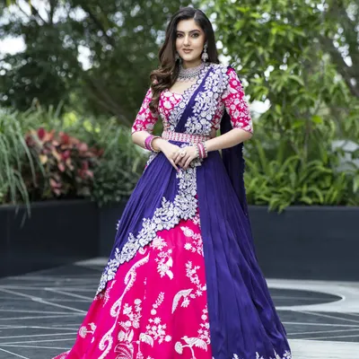 This ensemble showcases my passion for 3D embroidery and bold color blocking. The pink and blue lehenga features a sculpted skirt and a blouse detailed with intricate corded cut dana work, creating a striking, modern bridal look.