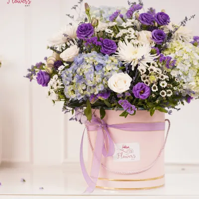 A beautiful arrangement of purple, blue, and white flowers including roses, hydrangeas, and chrysanthemums, presented in my signature pink bucket box. This is a perfect gift for birthdays, anniversaries, or corporate events.