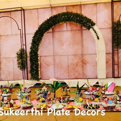 This large platter display was the main attraction at an engagement ceremony in Karumathampatti. The setup was designed to complement the stage decor, creating a cohesive and elegant look for the event.