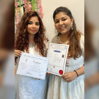 A proud moment achieving my Government Certified Nail Technician qualification alongside my mentor. This certification adds a layer of professional credibility.