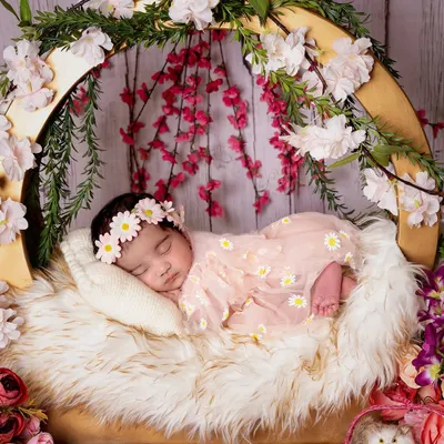 This is the magic I strive to create. A peacefully sleeping newborn, nestled in a bed of soft fur and flowers, dreaming her first dreams. Every detail is arranged with love to capture their pure innocence.