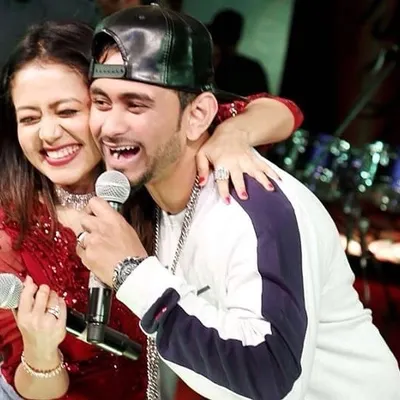 A candid moment on stage with the amazing Neha Kakkar during a live performance. My role as an emcee is to build a bridge between the artist and the crowd, keeping the concert's energy electric.