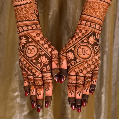 A perfect example of a personalized engagement design, featuring the couple's initials "JK" and intertwined rings. I love working with clients to add these meaningful details to their henna.