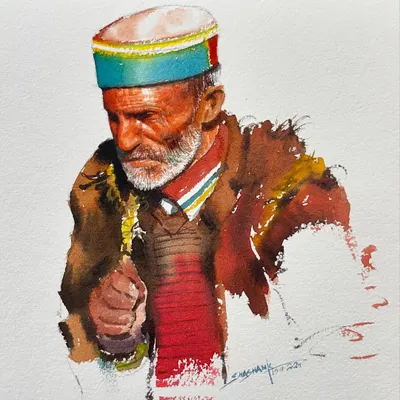 A watercolor portrait of a man from Himachal, focusing on his traditional cap and expressive face. This was a demonstration for an online class.