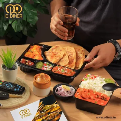A complete meal for one, featuring soft parathas, a rich paneer curry, dal, sabji, and salad. This is our regular veg thali, perfect for a satisfying lunch or dinner.