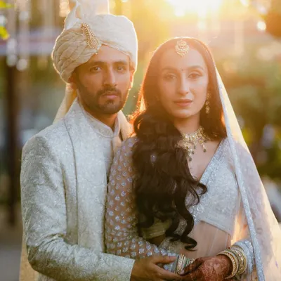 A stunning golden hour portrait of the bride and groom. This is the kind of light and emotion that makes wedding photography so magical.