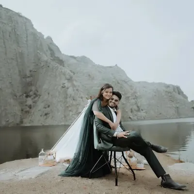 A dramatic, high-fashion pose against the stunning backdrop of a quarry lake. We love finding unique locations for pre-wedding photography that make your photos stand out.